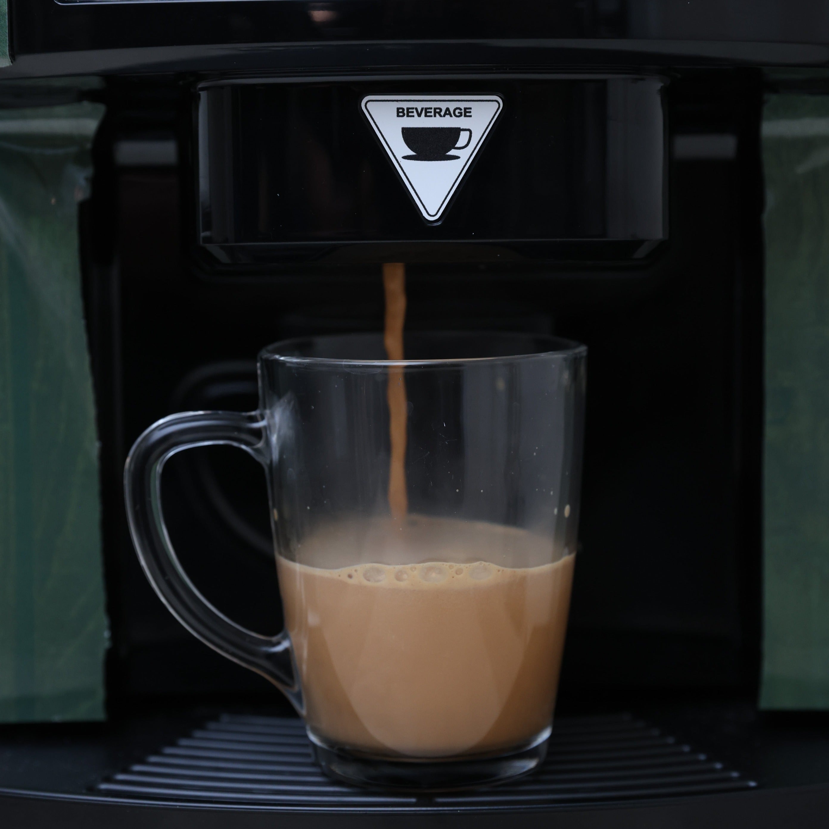Chai flowing from Nitan’s vending machine into cup
